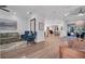 Bright living room with hardwood floors, comfortable seating, and an open floor plan to the dining area at 5507 Keeler Oak St, Lithia, FL 33547