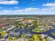 Expansive aerial view of waterfront homes, a marina, and a residential community under a bright blue sky at 5712 Biscayne Ct # 103, New Port Richey, FL 34652