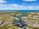 Stunning aerial view of waterfront community with private marina, coastal homes, and beautiful ocean views at 5712 Biscayne Ct # 103, New Port Richey, FL 34652