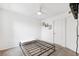 Simple bedroom ready for customization, featuring carpeted floors, and an overhead ceiling fan at 5712 Biscayne Ct # 103, New Port Richey, FL 34652