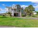 Charming condo with coastal curb appeal, lush lawn, and covered parking at 5712 Biscayne Ct # 103, New Port Richey, FL 34652