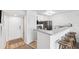 Modern kitchen with breakfast bar and stainless steel appliances at 5712 Biscayne Ct # 103, New Port Richey, FL 34652