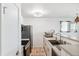 Well-lit kitchen area with stainless steel appliances and ample counter space at 5712 Biscayne Ct # 103, New Port Richey, FL 34652