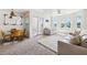 Bright living room with balcony access and cozy seating at 5712 Biscayne Ct # 103, New Port Richey, FL 34652