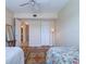 Cozy bedroom showcasing light, airy aesthetic, with ceiling fan and an ensuite bathroom at 6020 Shore S Blvd # 503, Gulfport, FL 33707