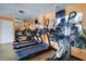 Community gym equipped with cardio machines, mirrors, and a television for entertainment at 6020 Shore S Blvd # 503, Gulfport, FL 33707