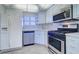 Kitchen featuring stainless steel appliances, and tile floors at 6020 Shore S Blvd # 503, Gulfport, FL 33707