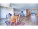 Open-concept living room with hardwood floors, a ceiling fan, and a view of the waterway at 6020 Shore S Blvd # 503, Gulfport, FL 33707