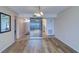 Bright living room with wood floors, a ceiling fan, and an open floor plan to the kitchen at 6020 Shore S Blvd # 503, Gulfport, FL 33707
