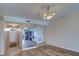 Living room featuring neutral walls, wood floors, and an elegant chandelier at 6020 Shore S Blvd # 503, Gulfport, FL 33707