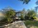 Stone path and lush landscaping lead to the screened in pool at 6073 115Th N Ave, Pinellas Park, FL 33782