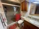 Bathroom featuring glass shower doors, wood vanity, and neutral colored walls at 6073 115Th N Ave, Pinellas Park, FL 33782