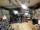 An organized garage with a motorcycle, storage shelves, tool chests, and work area at 6073 115Th N Ave, Pinellas Park, FL 33782
