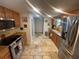 Bright kitchen featuring stainless steel appliances, tile flooring, and a window over the sink at 6073 115Th N Ave, Pinellas Park, FL 33782