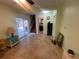 Living room with sliding door to pool and staircase to upstairs at 6073 115Th N Ave, Pinellas Park, FL 33782