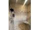 Standing shower with seat and neutral-colored tile at 6073 115Th N Ave, Pinellas Park, FL 33782
