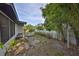 Spacious backyard showcasing tropical landscaping and ample room for outdoor activities at 6603 Oakview Ter, Tampa, FL 33610