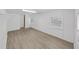 Spacious living room featuring new flooring and natural light from large windows at 6610 Myrna Dr, Tampa, FL 33619