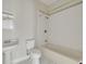 Well-lit bathroom featuring classic fixtures, bathtub and tile flooring at 6904 S Fitzgerald St, Tampa, FL 33616