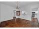 Elegant dining room featuring hardwood floors, wainscoting, and a vintage chandelier at 6904 S Fitzgerald St, Tampa, FL 33616
