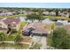 Aerial view of house showcasing the property and backyard pond at 7606 Nottinghill Sky Dr, Apollo Beach, FL 33572