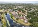 Beautiful aerial view showcasing homes surrounding a tranquil lake with lush green landscape at 7606 Nottinghill Sky Dr, Apollo Beach, FL 33572