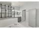 Bathroom features soaking tub, double vanity, and glass-enclosed shower at 7606 Nottinghill Sky Dr, Apollo Beach, FL 33572