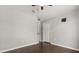 Bedroom with wood flooring, ceiling fan, and neutral wall color at 7606 Nottinghill Sky Dr, Apollo Beach, FL 33572