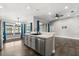 Kitchen featuring stainless steel appliances, an island, and lots of natural light at 7606 Nottinghill Sky Dr, Apollo Beach, FL 33572