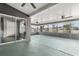 Enclosed lanai with sliding glass doors, offering serene backyard views at 7606 Nottinghill Sky Dr, Apollo Beach, FL 33572