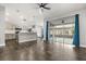 Open floor plan kitchen and living space with a large sliding door to the backyard at 7606 Nottinghill Sky Dr, Apollo Beach, FL 33572