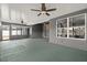 Large covered patio with ceiling fans and access to screened-in porch at 7606 Nottinghill Sky Dr, Apollo Beach, FL 33572
