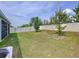 Large, well-maintained backyard featuring a lush lawn and a privacy fence at 8214 Wheat Stone Dr, Zephyrhills, FL 33540