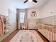 Bright Bedroom with wood floors, soft area rug, and a neutral decor scheme at 8214 Wheat Stone Dr, Zephyrhills, FL 33540