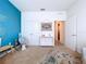 This bedroom offers a modern design with a cool accent wall and plenty of natural light at 8214 Wheat Stone Dr, Zephyrhills, FL 33540