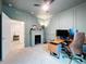 This home office offers a cozy fireplace and functional workspace, great for working from home at 8214 Wheat Stone Dr, Zephyrhills, FL 33540