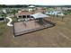 A playground with shade covering next to the community center and a large grassy area at 8214 Wheat Stone Dr, Zephyrhills, FL 33540