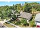 Picturesque aerial view of a well-maintained single Gathering home with a lush lawn and mature landscaping at 9535 Norchester Cir, Tampa, FL 33647