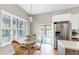Cozy dining area adjacent to kitchen, featuring natural light and a view to the outdoor pool at 9535 Norchester Cir, Tampa, FL 33647