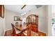 Elegant dining room area with a large wooden table, matching chairs, and decorative lighting at 9535 Norchester Cir, Tampa, FL 33647