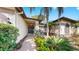 Inviting front entrance with manicured landscaping and a pathway leading to the front door at 9535 Norchester Cir, Tampa, FL 33647