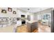 Inviting kitchen featuring an island, dining area, and modern appliances at 9535 Norchester Cir, Tampa, FL 33647