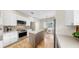 Bright kitchen featuring an island, stainless steel appliances, and a dining area with ample natural light at 9535 Norchester Cir, Tampa, FL 33647