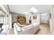 Open living room featuring entertainment center, fireplace, and sliding glass doors to outdoor living area at 9535 Norchester Cir, Tampa, FL 33647