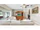 Spacious living room with a large entertainment center and comfortable white couches at 9535 Norchester Cir, Tampa, FL 33647