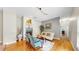 Comfortable living area with hardwood floors, a fireplace, and plenty of natural light at 9535 Norchester Cir, Tampa, FL 33647