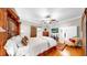 Relaxing main bedroom features hardwood floors, a ceiling fan, and access to the bathroom at 9535 Norchester Cir, Tampa, FL 33647