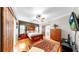 Comfortable main bedroom features a ceiling fan, wood floors, and access to the closet at 9535 Norchester Cir, Tampa, FL 33647
