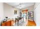 A home office featuring hardwood floors, decorative rug, and built-in bookshelves at 9535 Norchester Cir, Tampa, FL 33647