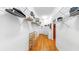 A walk-in closet featuring wood floors, wire shelving, and wooden shoe racks at 9535 Norchester Cir, Tampa, FL 33647